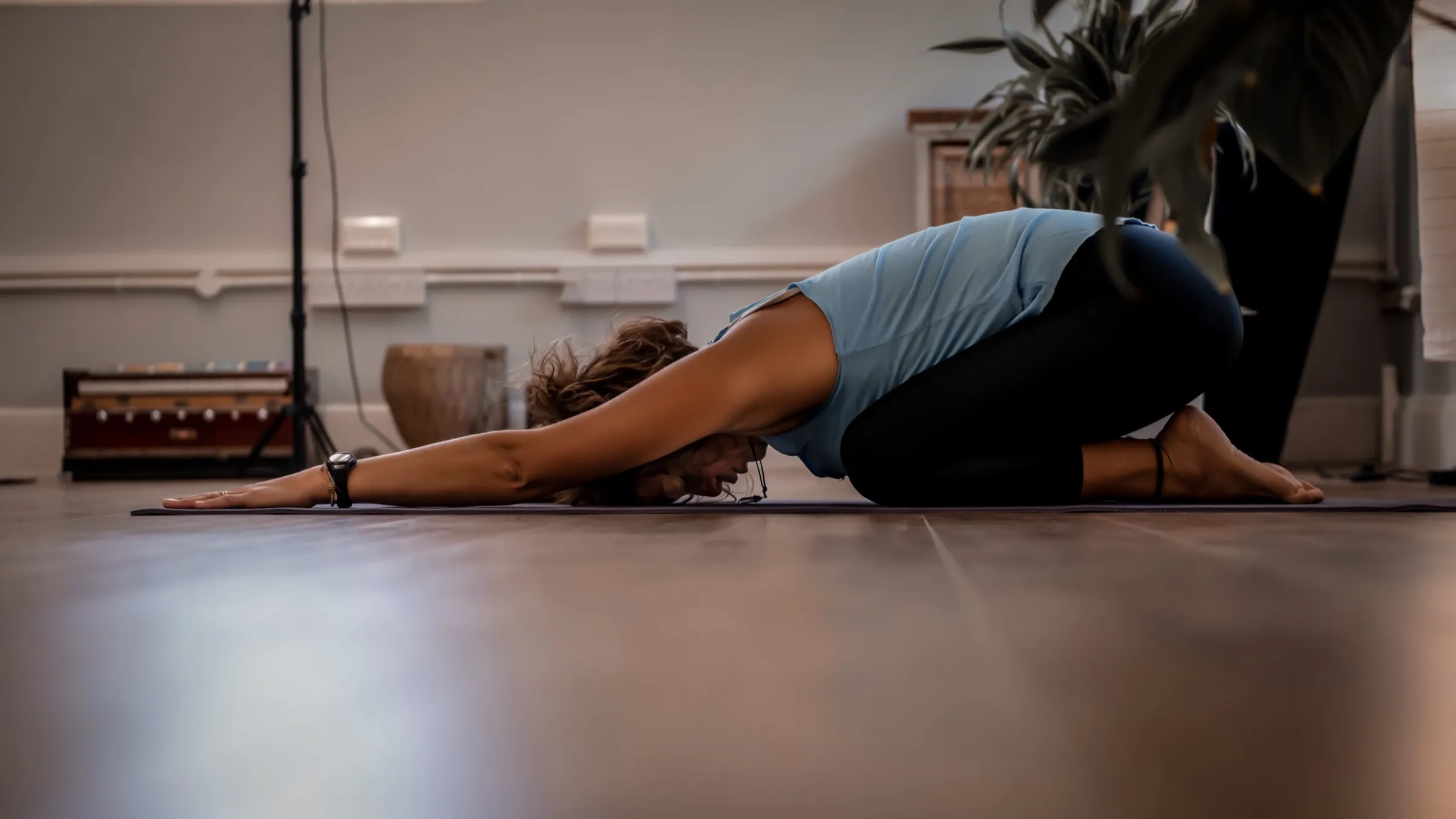 A student resting in child’s pose